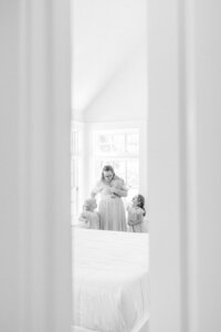 A mother and her children during a newborn photography session in Wilmington, North Carolina