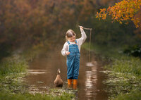 faye-child-portrait-in-waders-by-creek-dandenong-ranges