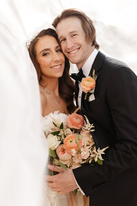 bride and groom smiling