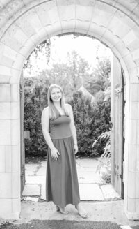 A classic photo taken by Studio Roscher of a happy high school female graduate in Alexandria, VA