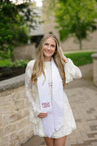 young graduate posing for her graduation pictures