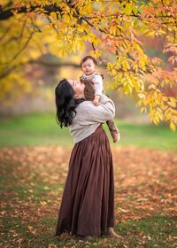 mother-holding-toddler-autumn-portrait-melbourne