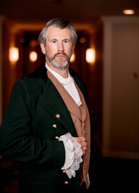 Portrait of a groom in a green velvet jacket at an Orlando wedding