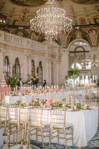 Candlelit reception table set beneath a hand painted domed ceiling at The Breakers Palm Beach