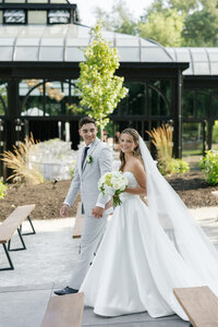 bride and groom walking happily during their wedding reception in ohio