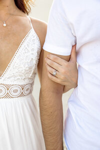 Couple posed on the sand dunes during a golden hour session in Palm Springs