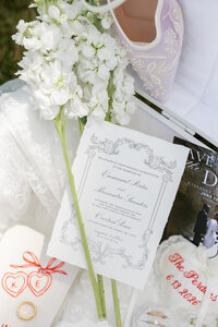 mockup of a wedding invitation sitting on white lace