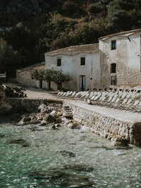 Secluded coastal retreat with stone villa and turquoise water in Italy