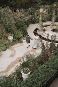 bride and groom holding hands