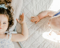 A close up photo of a childs hands during an in home photography session in Wilmington, North Carolina