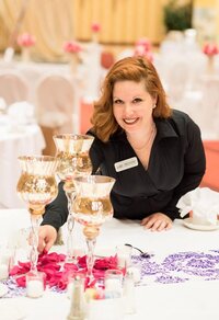 wedding planner sprinkling flower petals