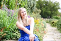 A classic photo taken by Studio Roscher of a happy high school female graduate in Alexandria, VA