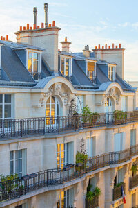 Elegant European waterfront buildings with colorful facades and balconies overlooking the water