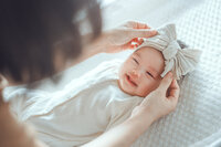 nurse-sascha-baby-with-bow