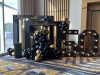 luxury balloon decor in black and gold for birthday