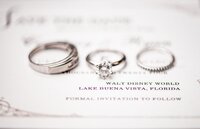 Walt Disney World wedding invitation and rings flatlay in Orlando