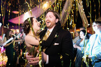 Bride and Groom dancing with gold streamers falling wedding reception at Noah Liff Opera Center Nashville — Weddings & Events by Raina