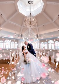 Bride and groom in a grand ballroom with chandeliers at an Orlando wedding
