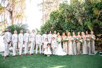 Wedding party lined up outdoors on the lawn at an Orlando wedding