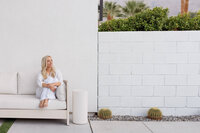 Celeste seated in a studio setting during a La Quinta branding photography session