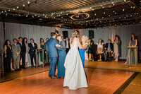 photos candid of wedding couple dancing at reception.