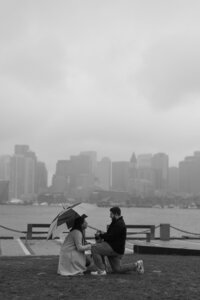 Black and White proposal photo with the Boston Skyline in the back.