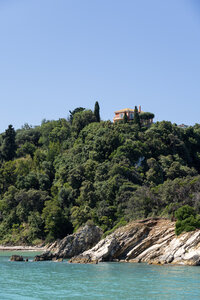 Villa perched above the turquoise coastline of Corfu, Greece