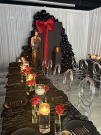 luxury event decor black and red with candlelit tablescape