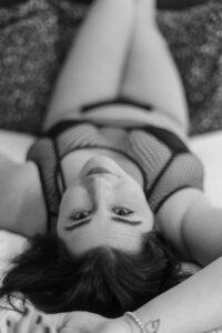 Black and white photograph of a Studio Roscher female boudoir client in Richmond, VA