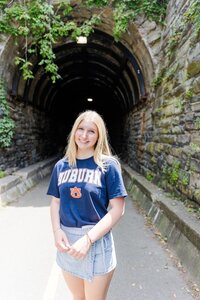 A classic photo taken by Studio Roscher of a happy high school female graduate in Alexandria, VA