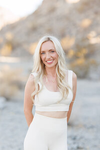 Celeste seated on a white sofa during a La Quinta branding photography session