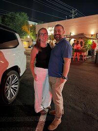 Emily, the photographer of Studio Roscher, smiling with her husband