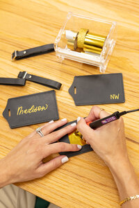 Nyssa of Use Your Words providing live calligraphy personalization for guests at a luxury event in New Jersey.