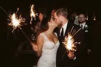 Romantic sparkler portrait of bride and groom at Nashville venue — Weddings & Events by Raina