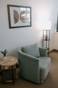 office chair and side table in therapy office.