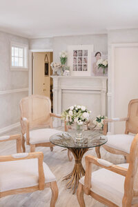 Seating area and fireplace at Sarah DiCicco's cottage studio in Wayne, Pennsylvania