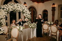 Bride and Groom toast during Maid of Honor speechWedding reception detail at Nashville venue — planned by Weddings & Events by Raina