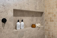 mediterranean-bathroom-arched-marble-mosaic-shower-niche