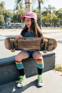 Personality-driven brand photography for Adventurous Heart Therapy featuring an outdoor portrait with a skateboard