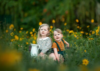 faye-sibling-childrens-portrait-in-yellow-flower-field-mitcham