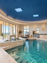 Luxury Indoor Pool with Curved Blue Dome