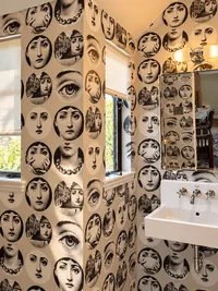 Eclectic Powder Room with Vintage Wallpaper