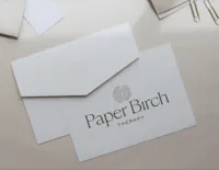 Paper Birch Therapy custom brand identity displayed on minimalist printed stationery