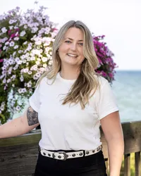 Portrait of the therapist behind Adventurous Heart Therapy, a Detroit private practice with an adventurous and personality-driven brand