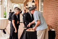 Wedding planner with Weddings & Events by Raina assists wedding guests