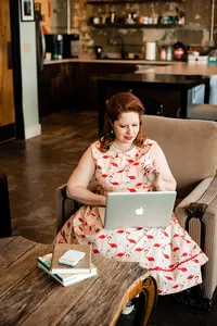 Weddings & Events by Raina wedding planner answering emails, making phone calls and doing paperwork.