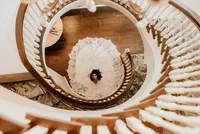 Bridal portrait down spiral staircase at Nashville Tennessee venue — Weddings & Events by Raina