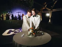 Will and Cameron cake cutting same-sex wedding reception at Cheekwood Botanical Garden Nashville — Weddings & Events by Raina