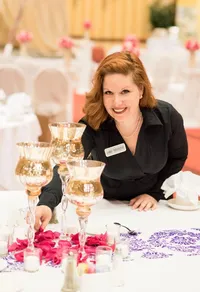 wedding planner sprinkling flower petals