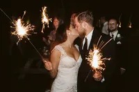 Romantic sparkler portrait of bride and groom at Nashville venue — Weddings & Events by Raina